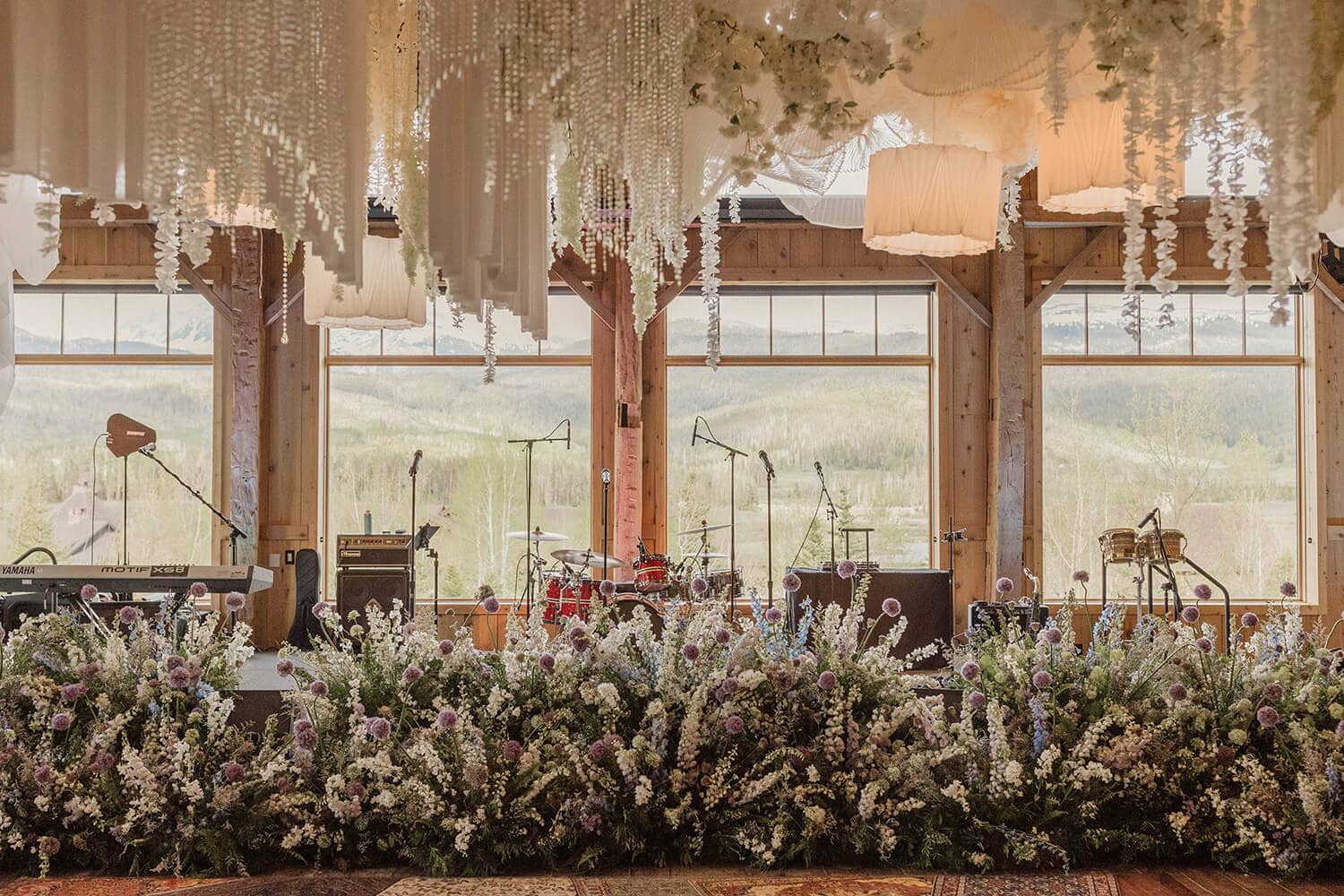 Charming wedding stage decorated with flowers and drapery, perfect for a Colorado wedding celebratio.